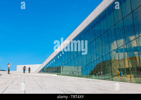 Oslo Opera House, view in summer of a tourist taking a photo on the vast access ramp leading to the roof of the Oslo Opera House, Norway. Stock Photo