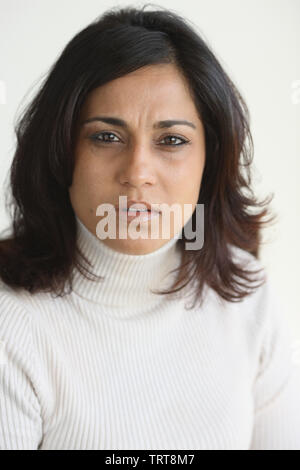 Close up of a woman looking worried Stock Photo