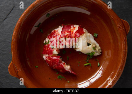 The cooked tail section of a boiled lobster Homarus gammarus, with the shell removed. From a lobster caught in a pot set in the English Channel. Displ Stock Photo