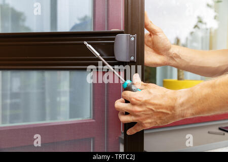 mosquito net wire screen door installation Stock Photo