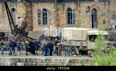 Glasgow, Scotland, UK 12th June, 2019. Smoke on the water as Steven Spielberg first world war movie “1917”  continues filming in the Govan graving docks on the banks of the river Clyde in the city today as Sam Mendes directs fanous actors dressed as britishww1 soldiers with period trucks. Credit: Gerard Ferry/ Alamy Live News Stock Photo