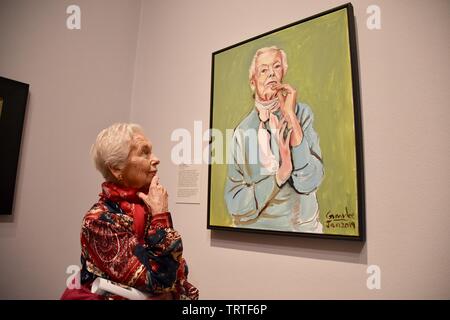 London, UK. Model Theresa gazes at Aunty Theresa by Gandee Vasan. BP Portrait Award 2019 Press Day, The exhibition runs from 13 June to 20 October 2019. National Portrait Gallery, St Martin's Place, London. UK Credit: michael melia/Alamy Live News