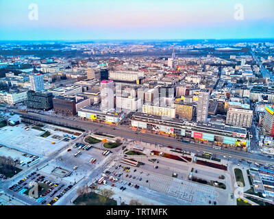 WARSAW, POLAND - APRIL 07, 2019: Beautiful panoramic aerial drone view to the center of Warsaw City in the sunset time in spring Stock Photo