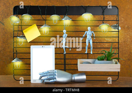 A black rack in front of real rust. Mine lights shine. Two robot figures and a robot arm point the view towards a free space on a tablet that gives ro Stock Photo