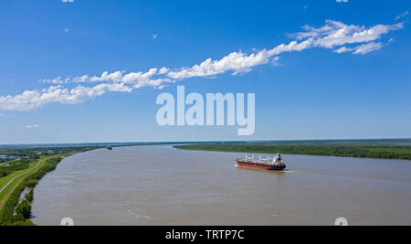 Empire, Louisiana - The Greek bulk carrier Doric Victory sails towards New Orleans on the Mississippi River near the Gulf of Mexico. Stock Photo