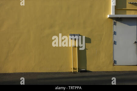 electrical switchboard controls on the wall. Stock Photo