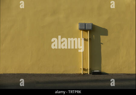 electrical switchboard controls on the wall. Stock Photo