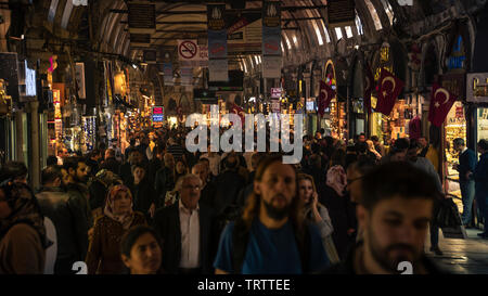 Egyptian Bazaar or Spice Bazaar. People walking and shopping inside the Spice Bazaar (Misir Carsisi) one of the largest bazaars in istanbul, Turkey. Stock Photo