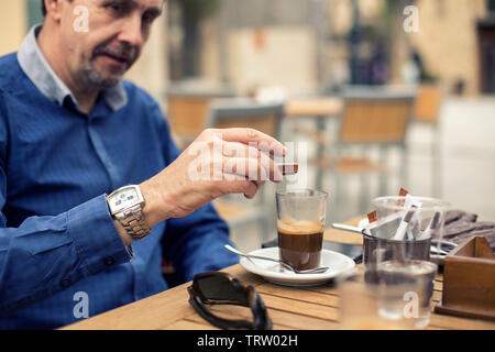 Adult man having breakfast in the terraze outdoor in Madrid. Spain Stock Photo