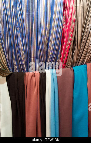 carpets, scarfs and blankets piled in a moroccan textile shop Stock ...