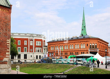 RIGA, LATVIA - AUGUST 28, 2018: Art museum 'Riga Stock Exchange' and the spire of St. James's Cathedral on the Dome square in the summer Stock Photo