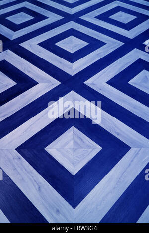 Vertical image of geometric pattern wooden floor in royal blue and light blue color Stock Photo