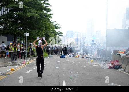 Hong Kong, China. 12th June, 2019. Unidentified protesters walks toward the police force defense line during protests against extradition law in Hong Kong Credit: Thomas Bertson/Alamy Live News Stock Photo