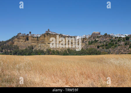 Panorama of white village Arcos de la Frontera, Andalusia, Spain. Image taken from wheat fields Stock Photo