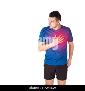 Caucasian man athlete looking aside feeling heart attack or chest pain isolated over white background. Sportsman suffering muscle cramp. Sport traumas Stock Photo