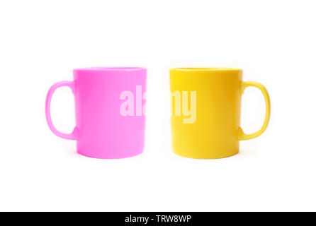 Two colored ceramic cups isolated on a white background Stock Photo