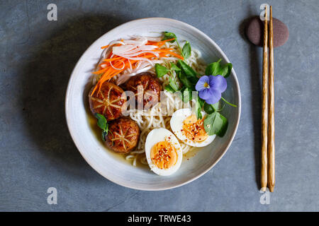 Japanese miso ramen with stuffed mushrooms, noodles and egg Stock Photo