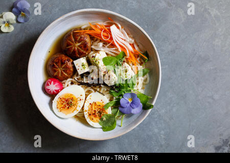 Japanese miso ramen with stuffed mushrooms, noodles and egg Stock Photo