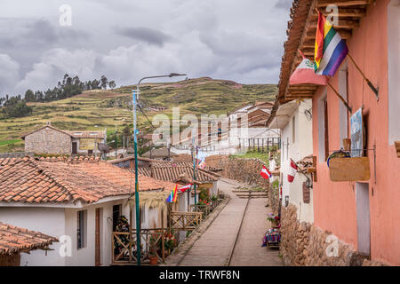 Hillside street of Cuzco, Peru with mountain in the background Stock Photo