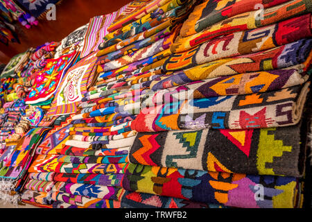 Peruvian traditional colourful native handicraft textile fabric at market in Peru Stock Photo