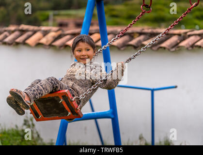 Cuzco, Peru - April 30, 2019. A Peruvian kid playing at play ground Stock Photo