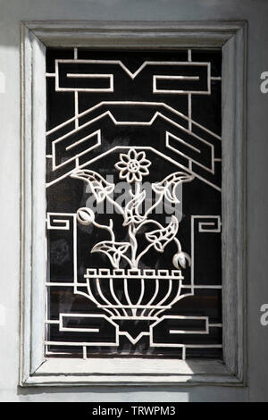 Detail of an old door with wrought iron decorations Stock Photo