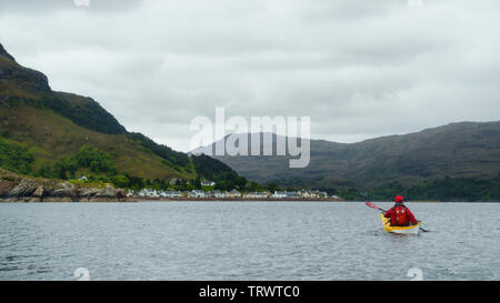 Sea kayaking on Loch Shieldaig, Torridon, Wester Ross National Scenic Area, Highlands, Scotland Stock Photo