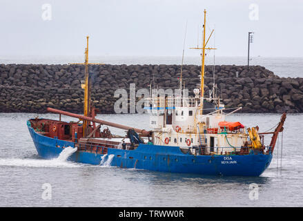 LANDEYJAHOFN, ICELAND - Ship dredging harbor at Westman Islands ferry terminal. Stock Photo