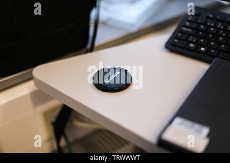 Canon lens cap on a desk Stock Photo