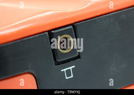 Vintage orange philips plastic transistor radio headphones input jack, isolated on a white background Stock Photo