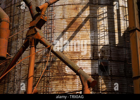 Close up view of an old rusty silo used to gather corn. Stock Photo