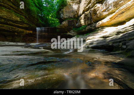 Water flowing down La Salle Canyon in Starved Rock State Park on a beautiful Spring morning.  Illinois, USA Stock Photo