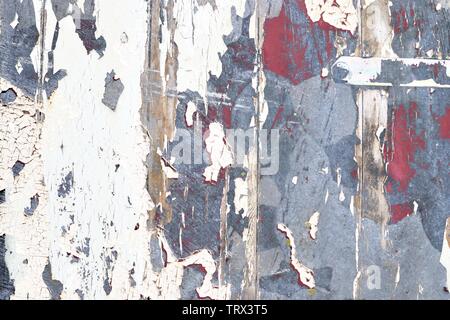 Detailed close up view on colorful peeling paint on aged and weathered concrete walls Stock Photo