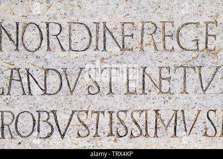Rythmic epitaph on the marble gravestone of the Lombard King Cuniperto (also called Cuningpert, Cunicpert, Cuninopert) in Castello Visconteo,Pavia,IT. Stock Photo
