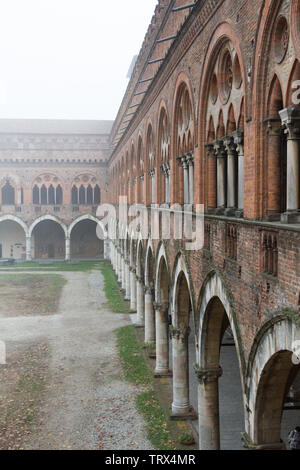 Pavia, Italy. November 11 2017. Castello Visconteo (Visconteo castle) on a foggy day. Stock Photo