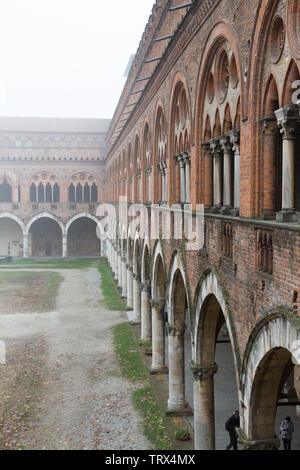 Pavia, Italy. November 11 2017. Castello Visconteo (Visconteo castle) on a foggy day. Stock Photo