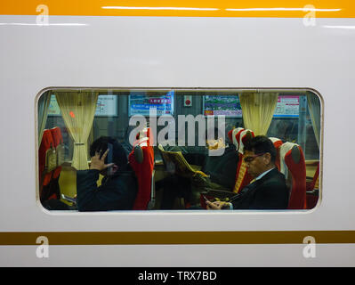 Osaka, Japan - Apr 18, 2019. Train stopping at railway station in Osaka, Japan. Trains are a very convenient way for visitors to travel around Japan. Stock Photo