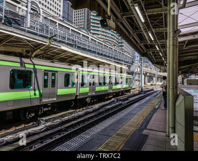 Osaka, Japan - Apr 18, 2019. Train stopping at railway station in Osaka, Japan. Trains are a very convenient way for visitors to travel around Japan. Stock Photo