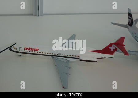 Osaka, Japan - Apr 18, 2019. Toy model airplane (Fokker 100 Swissair) at the aviation museum of Kansai Airport (KIX) in Osaka, Japan. Stock Photo