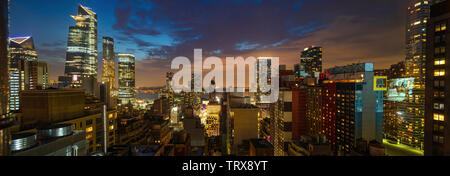 New York city skyline panorama at night. Aerial panoramic view of Manhattan illuminated skyscrapers after the sunset Stock Photo