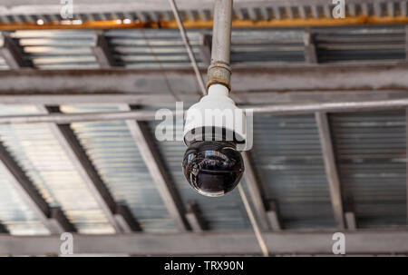 CCTV Security system. Surveillance Camera on the roof outdoors, metal sheets background, closeup view Stock Photo
