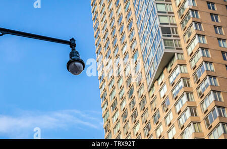 CCTV Security system. Surveillance Camera outdoors, skyscraper and blue sky background, low angle view Stock Photo