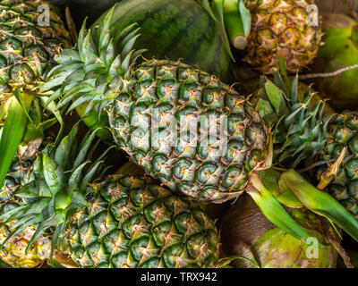Fresh summer fruit, pineapples, watermelon and coconut backgrounD Stock Photo