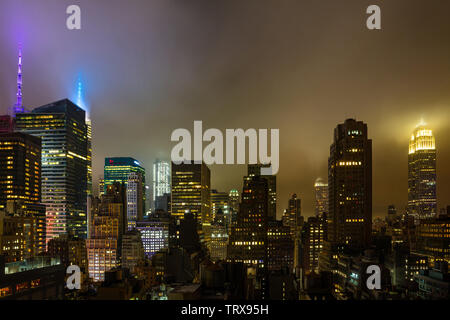 New York city skyline at night. Aerial view of Manhattan skyscrapers and Empire state building, illuminated