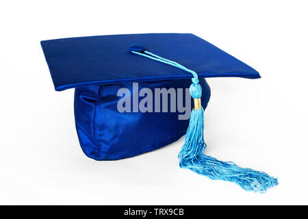 Blue graduation cap or mortarboard with blue tassel isolated on white background. Stock Photo