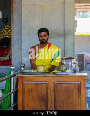 A hindu priest at Deviramma Temple in traditional attire with copy space Stock Photo