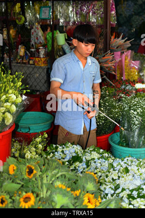 Ho Chi Minh City, Vietnam - June 01, 2019; Crowded Flower market in the Early Morning. Stock Photo
