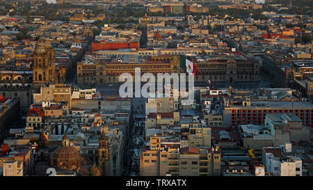 Plaza de la Constitución, Zócalo, from above.  Palacio Nacional (National Palace) behind Mexican flag, Metropolitan Cathedral on left, Mexico City. Stock Photo