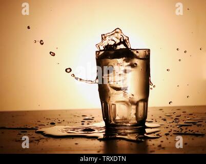Water in glass splashed Stock Photo