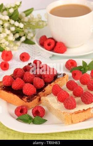 Delicious toast with raspberries on table close-up Stock Photo